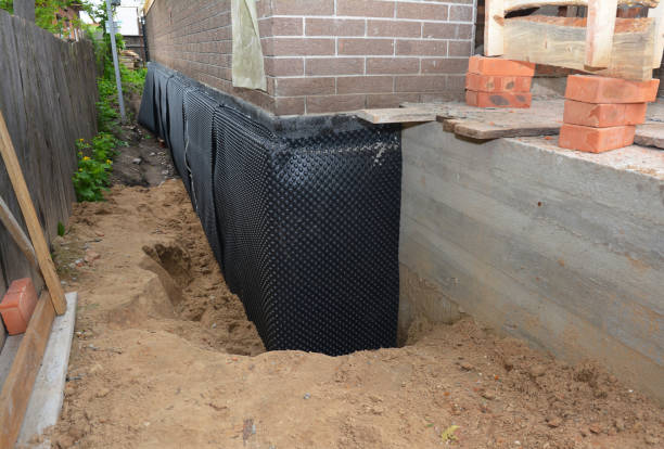 SJ Waterproofing Pros technician performing targeted Foundation Crack Repair assessment in Carle Place, NY